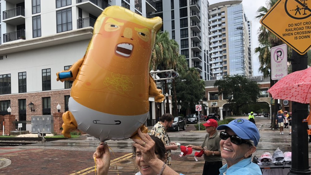 President Trump protesters rally at bar blocks from arena speech