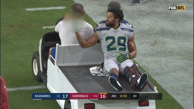 Thomas gestures toward Seattle sideline after broken leg