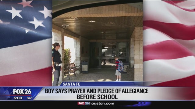 Photo of Santa Fe child praying and saying Pledge of Allegiance goes viral
