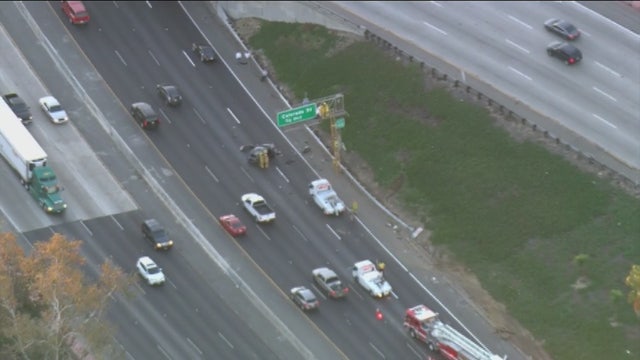 Man killed in 5 Freeway rollover crash, ejected onto freeway sign