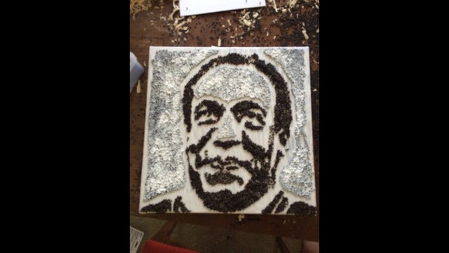 Portrait of Bill Cosby made with rapeseed pulled from State Fair