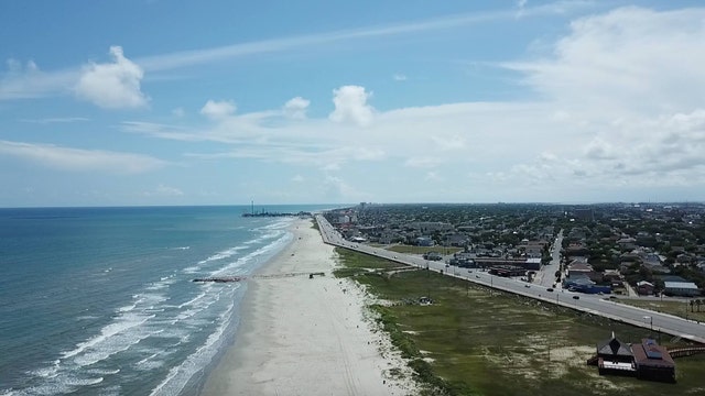 Photos show clear blue water at Galveston beach