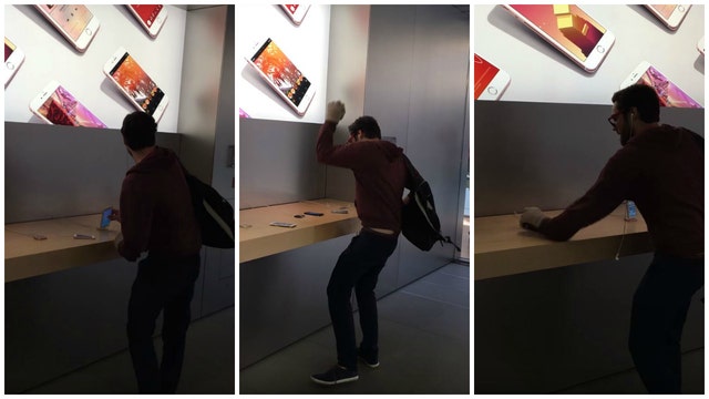 Video captures angry man smashing his way through an Apple store