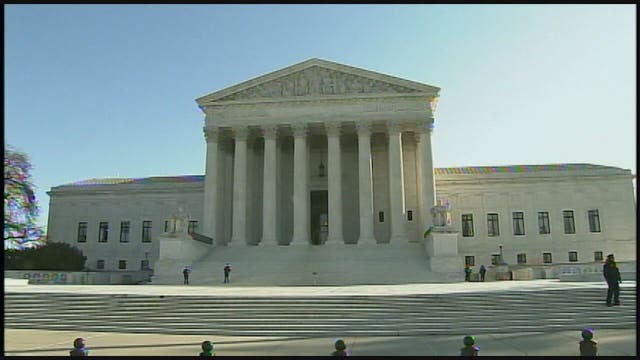 Trump travel ban partly reinstated; fall court arguments set