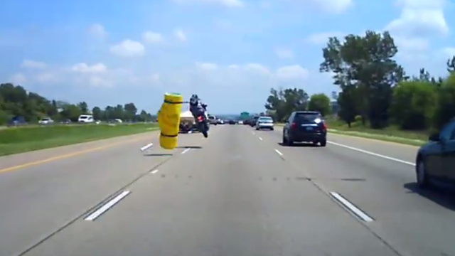 DASHCAM: Motorcycle hits unsecured load on I-94 in Woodbury, Minn.