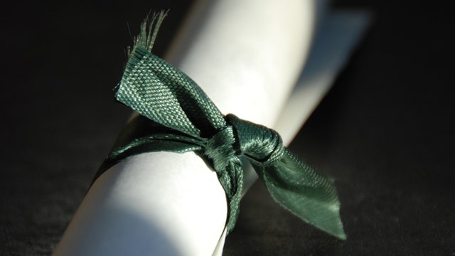 High school under fire for refusing to allow cancer survivor to sit with graduating class