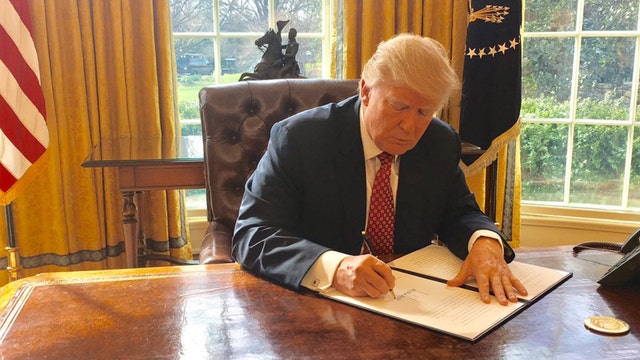 Trump signs new anti-terror travel ban without new fanfare