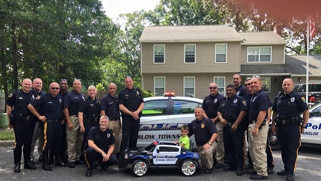 Police surprise boy who bought them lunch with mini police cruiser