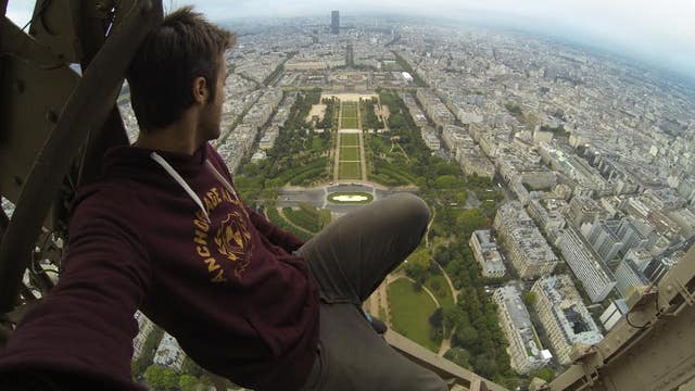 Caught on video: Daredevils climb Eiffel Tower, hide from guards