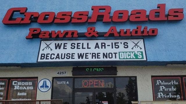 Pawn shop trolls Dick's Sporting Goods with sign advertising AR-15's