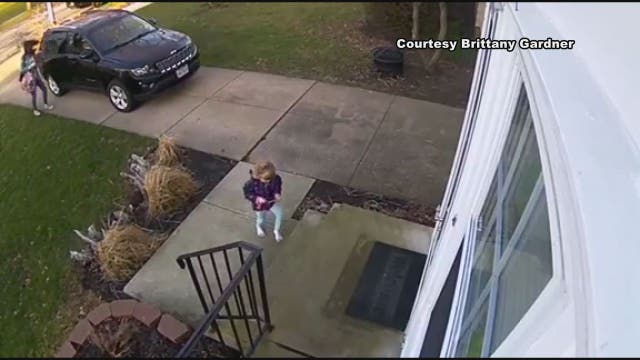 WATCH: Wind sweeps girl clutching door off her feet