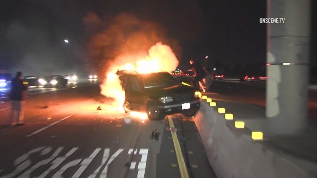 Photojournalist rescues driver trapped in burning car