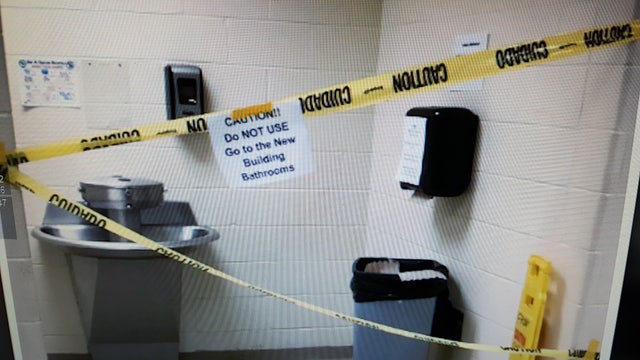 Investigators say teen hid in school's restroom ceiling to spy on girls