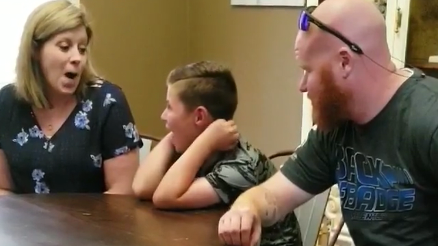 Slain Texas officer's son gets surprise trip to Cowboys camp