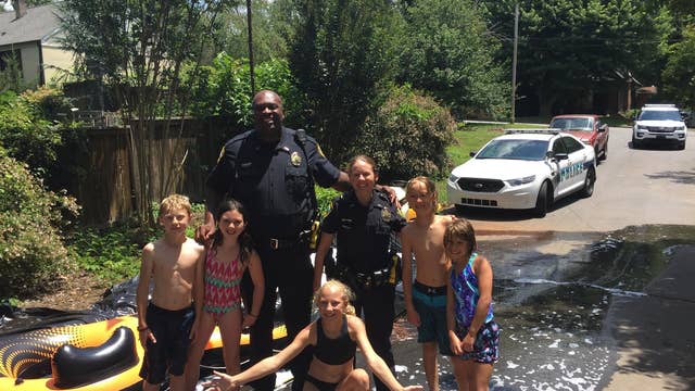 NC officers respond to call, join in on 4th of July slip and slide