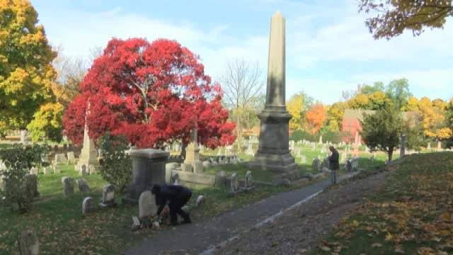 Women leave 'I Voted' stickers at Susan B. Anthony grave