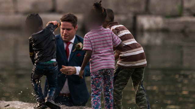 Groom jumps in water to save drowning boy