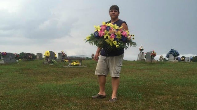 Brother and sister return flowers to gravesites after storm