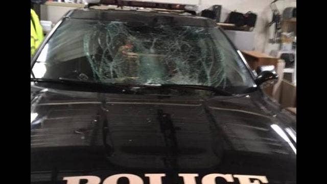 WATCH: Drunk guy rings in New Year by belly-flopping on cop's windshield