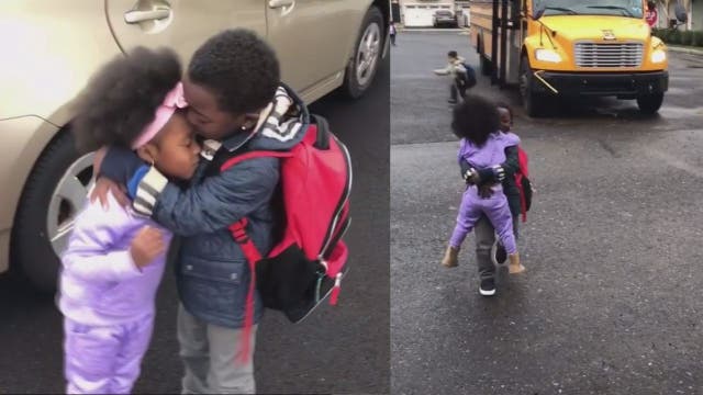 Siblings hug and kiss each other everyday after school bus drop off