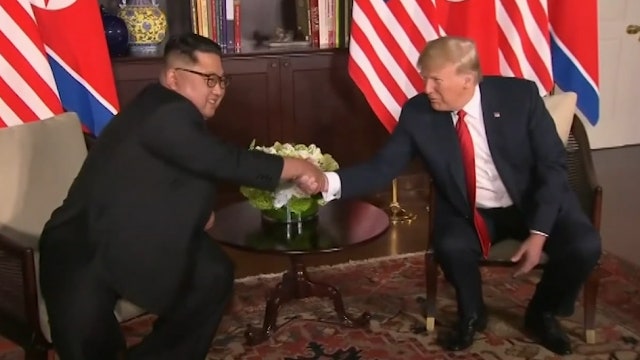 Trump-Kim shake hands, commit to 'complete denuclearization'