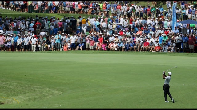 Woods in the hunt as rain suspends play at PGA Championship
