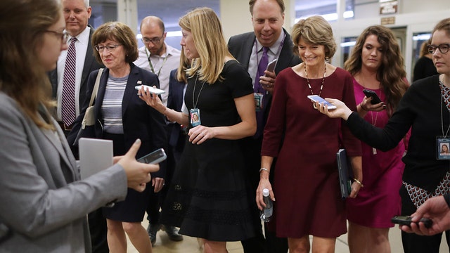 Senators pivotal in Kavanaugh vote criticize Trump's ridiculing comments on Ford