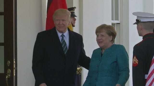 Trump, Merkel try to sidestep differences in first meeting
