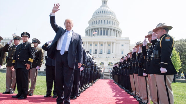 Trump pays tribute to fallen officers in emotional ceremony