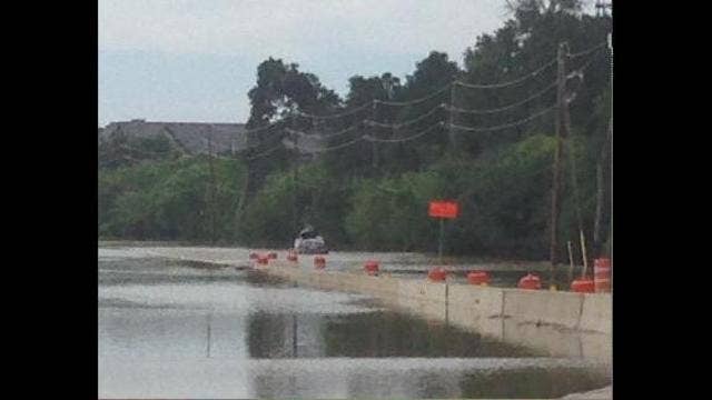 Woman arrested following rescue from flood water
