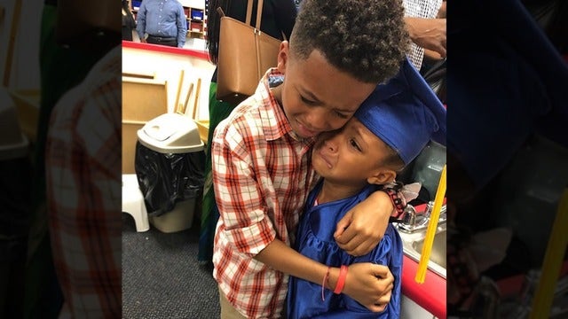 Photo of brother hugging his little sister after pre-school graduation goes viral