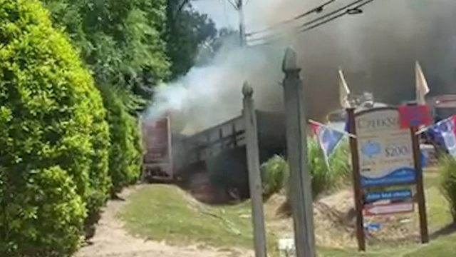 Landscaper transforms into lifesaver, pulls man from burning truck