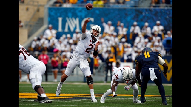 Rudolph shines in rain, No. 11 Oklahoma St. beats No. 22 WVU