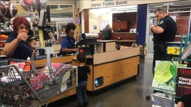 Officer buys stranger's groceries, gets toy for her son