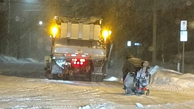 Snowplow driver clears path for man in wheelchair stuck in snow