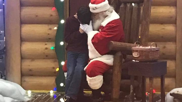 Photo captures moment boy asks Santa to help his sick father
