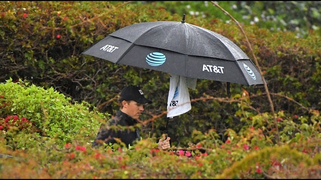 Spieth tied for lead after 12 holes at rainy Riviera