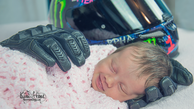 Photo of baby girl cradled in her late father's motorcycle gear goes viral