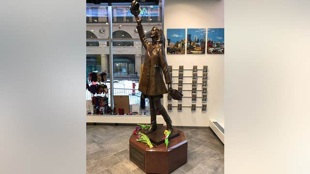 Flowers laid at Mary Tyler Moore statue in Minneapolis