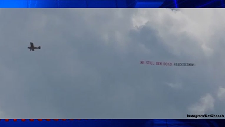 133ff6aa-Plane over Eagles practice