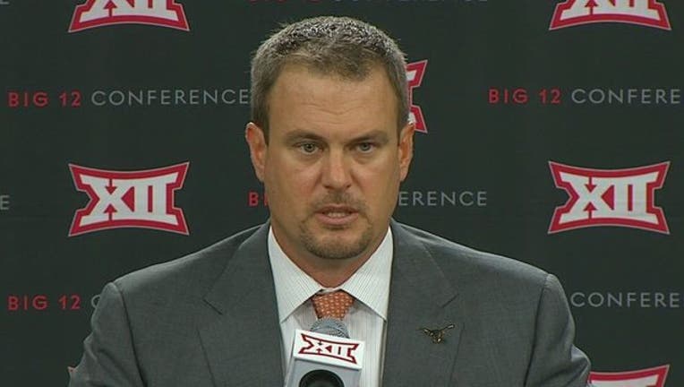 1b27b14d-Tom Herman Big 12 Media Days_1500412379542.jpg