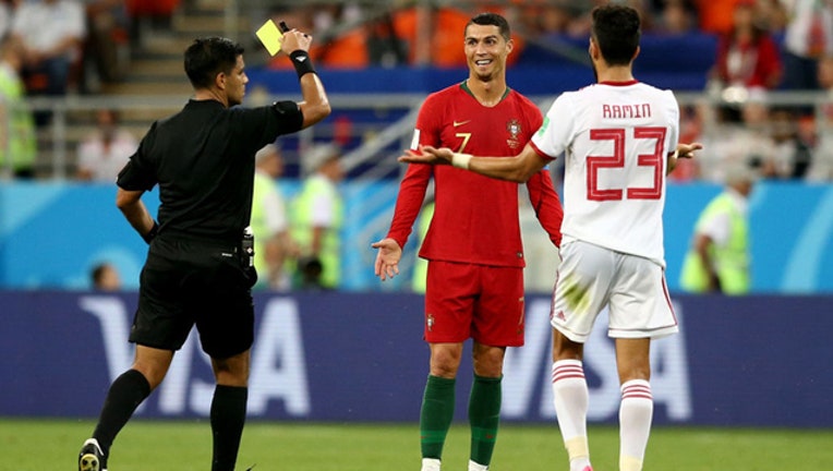Portugal draws 1-1 vs. Iran, advances to knockout round in ...