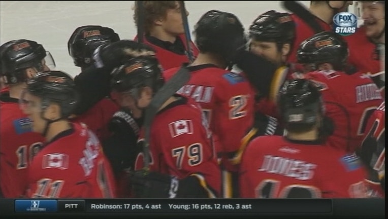 39c671f9-Stars Lose To Flames_1449087059043.jpg