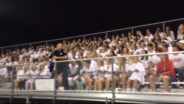 807a7122-wisconsin officer cheers_1506016903660-407068.PNG