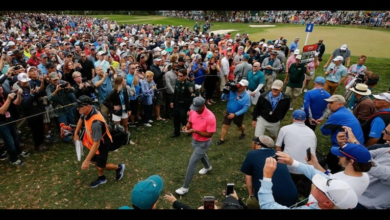 872e0fde-Tiger Woods_1520724084409