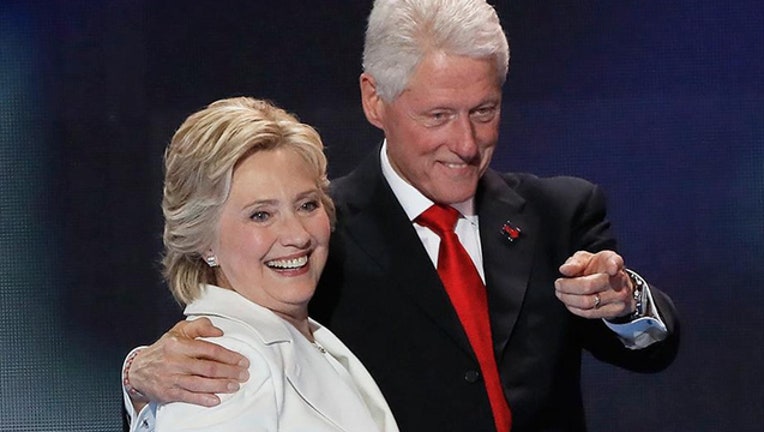 aba0291c-Bill and Hillary Clinton