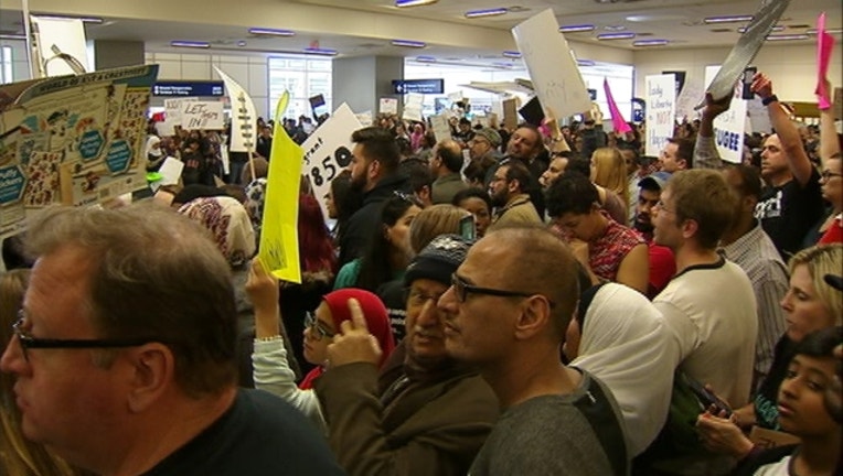 dfw airport immigration travel ban protest
