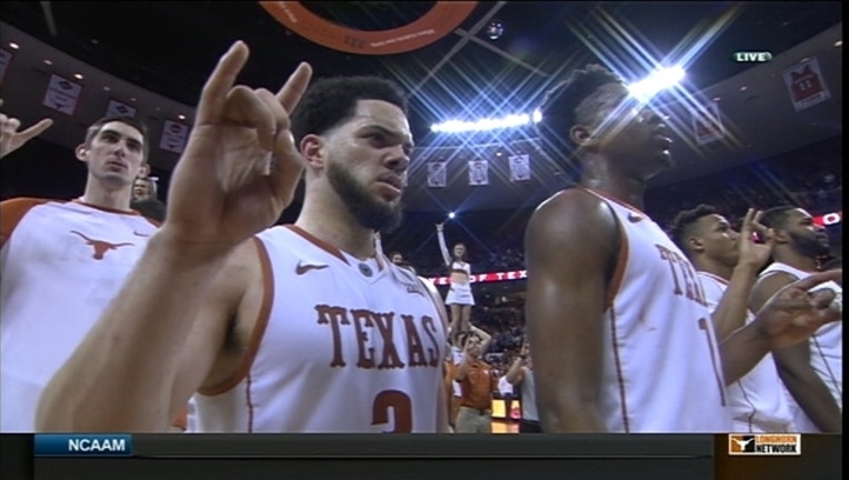 Longhorns Win and Pose_1454802222661.jpg