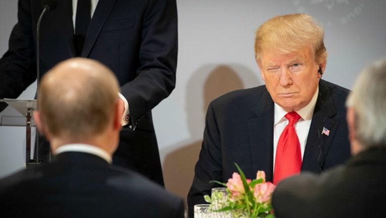 c6e3e366-GETTY President Trump and Russian President Vladimir Putin in Paris-404023