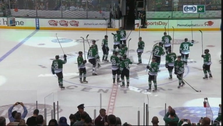 dallas stars sticks raised
